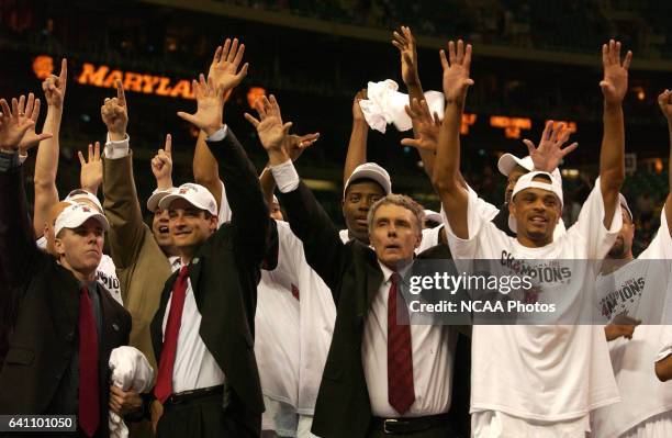 Members of the Maryland Terapins basketball team including head coach Gary Williams and Juan Dixon wave to their fans following the NCAA Photos via...