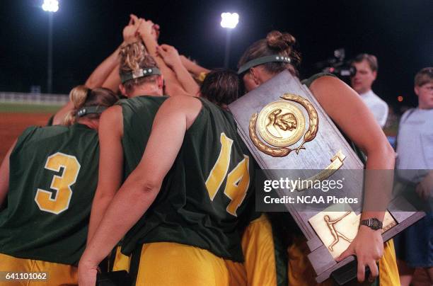 The North Dakota State University team gathers in celebration after defeating Kennesaw State University during the Division II Women's Softball...