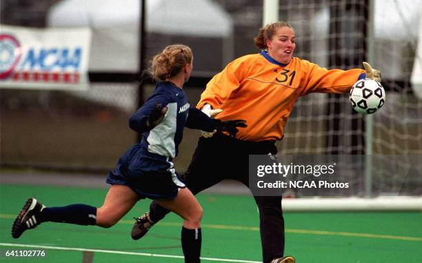 Ohio Wesleyan University goalie Mindy Hammond gobbles up a shot by Messiah College's Erin Benedict during the Division III Women's Soccer...