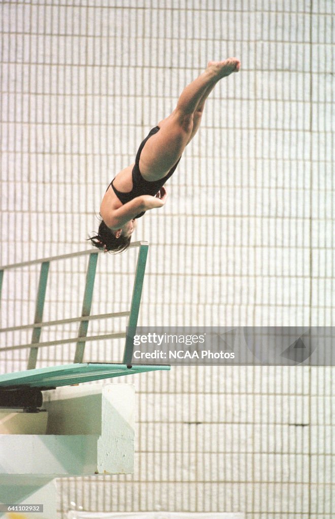 Maureen Singer dives off the springboard in the 3 meter springboard ...