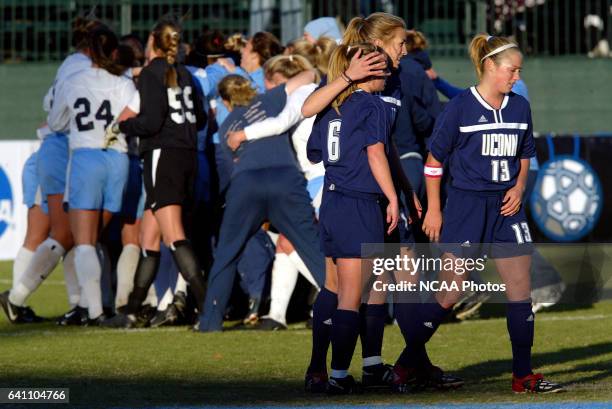 Kristin Fisher , Kristen Graczyk and Kathleen Frank of the University of Connecticut console each other after losing to the University of North...