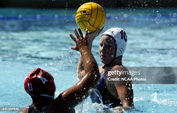 Kelly Rulon of UCLA looks for an opening past Brenda Villa of Stanford University during the Division 1 Women's Water Polo Championship held at the...
