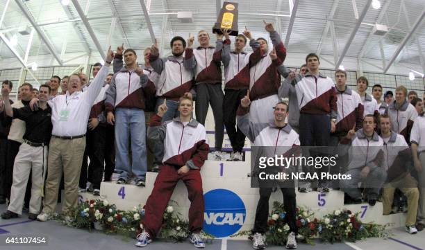 Members of the University of Wisconsin - La Crosse men's track team hoist thier first place trophy at the NCAA Photos via Getty Images Division III...