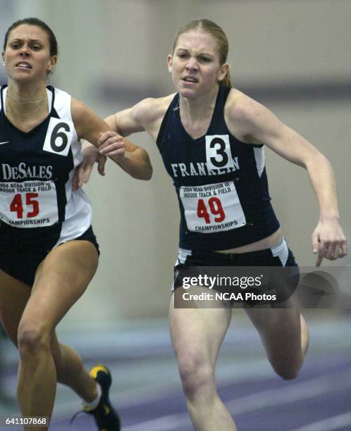Photos via Getty Images DIVISION III TRACK,WHITEWATER, WIS, MARCH 13, 2004--- DeSales University's Gina Lucrezi and Franklin College's Robyn Burns...