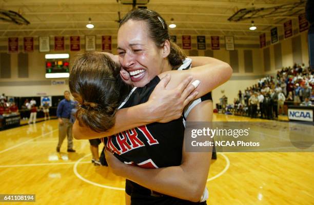 Kelly Dantas and Melissa Lehman of Barry University celebrate their victory over Truman State University during the Division II Women's Volleyball...