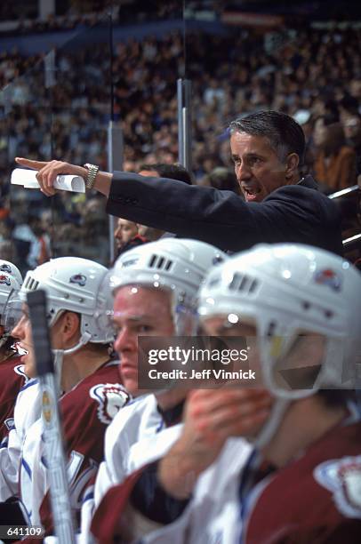 Head Coach Bob Hartley of the Colorado Avalanche yells from the bench during the game against the Vancouver Canucks at the GM Palace in Vancouver,...