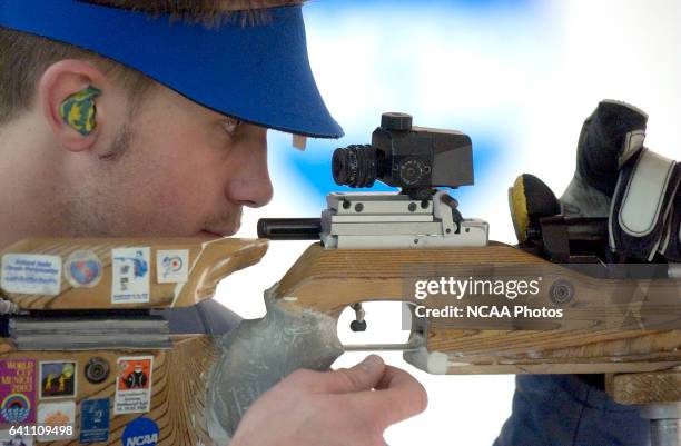 Matt Rawlings of Alaska Fairbanks loads his air rifle during the Division 1 Men's and Women's Rifle Championship held at the United States Olympic...