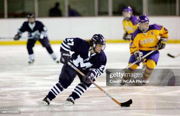 Tania Kenny of Middlebury College skates down ice with the puck against Elmira College during the Division III Women's Ice Hockey Championship held...