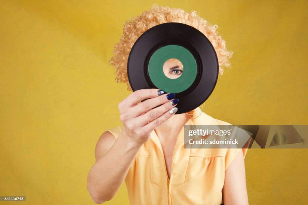 70's Disco Woman Looking Through 45 Record