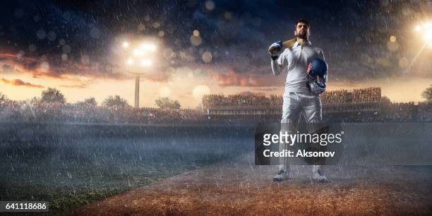 cricket: batsman on the stadium in action - cricket player isolated stock pictures, royalty-free photos & images