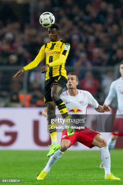 Ousmane Dembele of Borussia Dortmund and Kyriakos Papadopoulos of RB Leipzig battle for the ball during the Bundesliga soccer match between Borussia...
