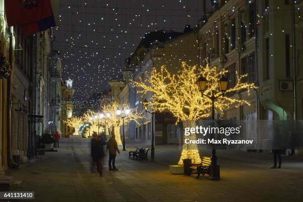 beautifully decorated and illuminated pedestrian street in the center of moscow - row of christmas trees stock pictures, royalty-free photos & images