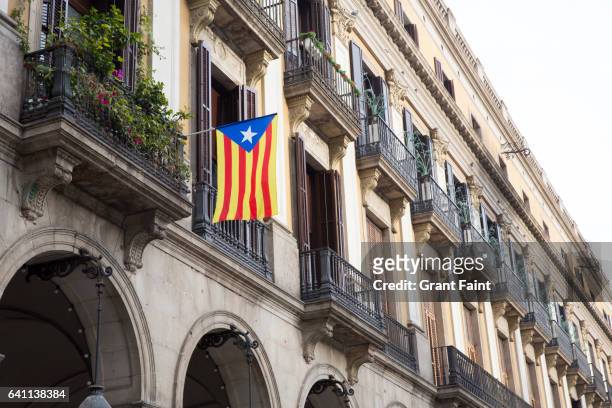 flag on balcony. - catalonia flag stock-fotos und bilder