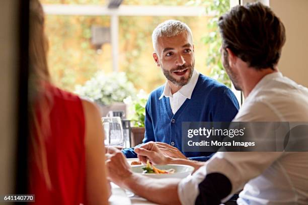 businessman talking with colleague in restaurant - business lunch outside stock pictures, royalty-free photos & images