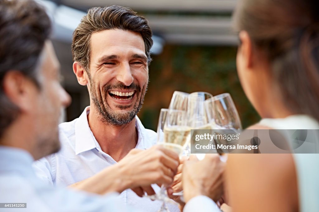 Business people celebrating success during lunch