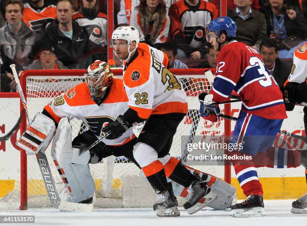 Mark Streit of the Philadelphia Flyers skates in front of goaltender Michal Neuvirth against Brian Flynn of the Montreal Canadiens on February 2,...