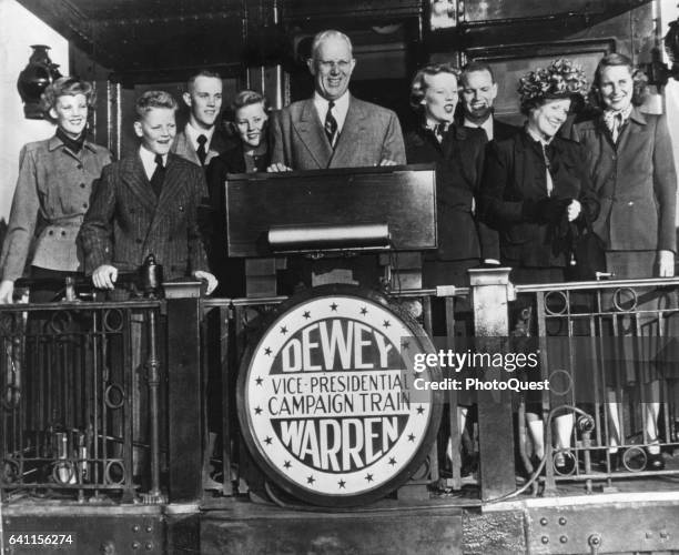 American politician and Republican Vice-Presidential candidate California Governor Earl Warren , along with his family, delivers a campaign speech...