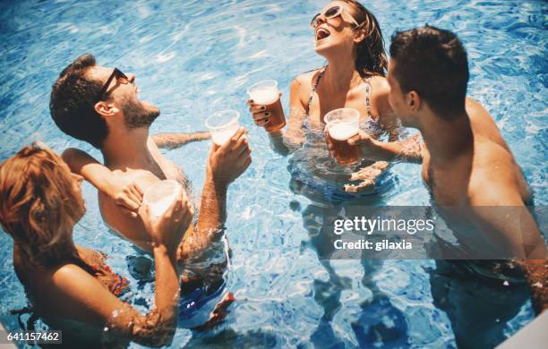 swimming pool fun. - lido stock pictures, royalty-free photos & images