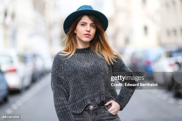 Sara Carnicella, fashion blogger from La Fille Rebelle, wears Texto black shoes, a Zara gray wool pull over, Calzedonia fishnet tights, Zara gray...