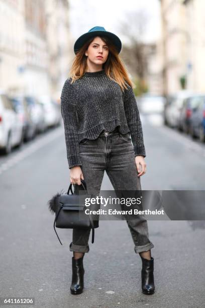 Sara Carnicella, fashion blogger from La Fille Rebelle, wears Texto black shoes, a Zara gray wool pull over, Calzedonia fishnet tights, Zara gray...