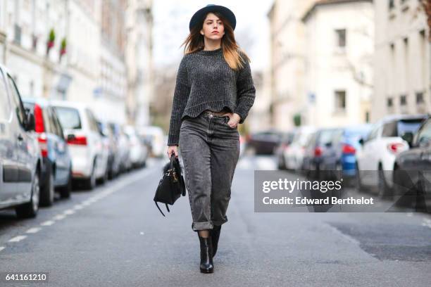 Sara Carnicella, fashion blogger from La Fille Rebelle, wears Texto black shoes, a Zara gray wool pull over, Calzedonia fishnet tights, Zara gray...