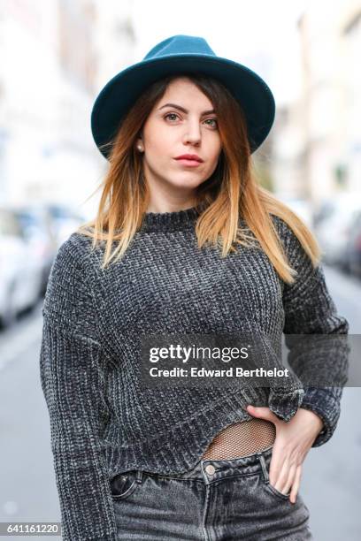 Sara Carnicella, fashion blogger from La Fille Rebelle, wears Texto black shoes, a Zara gray wool pull over, Calzedonia fishnet tights, Zara gray...