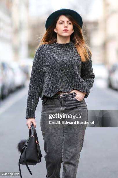 Sara Carnicella, fashion blogger from La Fille Rebelle, wears Texto black shoes, a Zara gray wool pull over, Calzedonia fishnet tights, Zara gray...