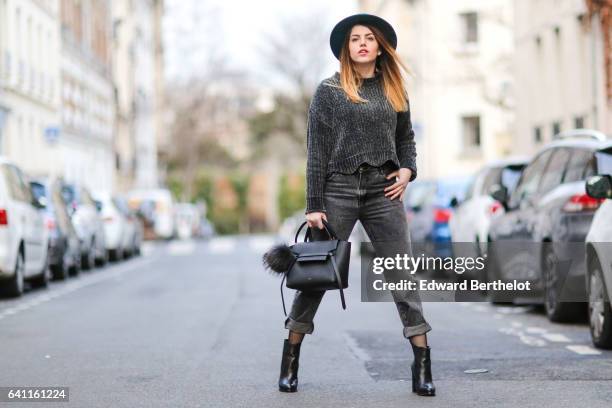 Sara Carnicella, fashion blogger from La Fille Rebelle, wears Texto black shoes, a Zara gray wool pull over, Calzedonia fishnet tights, Zara gray...