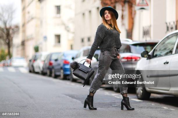 Sara Carnicella, fashion blogger from La Fille Rebelle, wears Texto black shoes, a Zara gray wool pull over, Calzedonia fishnet tights, Zara gray...