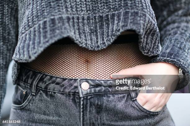 Sara Carnicella, fashion blogger from La Fille Rebelle, wears Texto black shoes, a Zara gray wool pull over, Calzedonia fishnet tights, Zara gray...