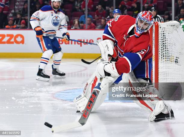 Al Montoya of the Montreal Canadiens clears the puck against the Edmonton Oilers in the NHL game at the Bell Centre on February 5, 2017 in Montreal,...