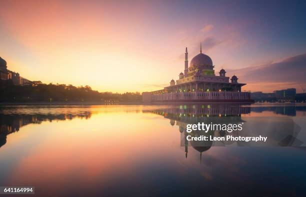 beautiful sunrise at putrajaya mosque - masjid wilayah stock pictures, royalty-free photos & images