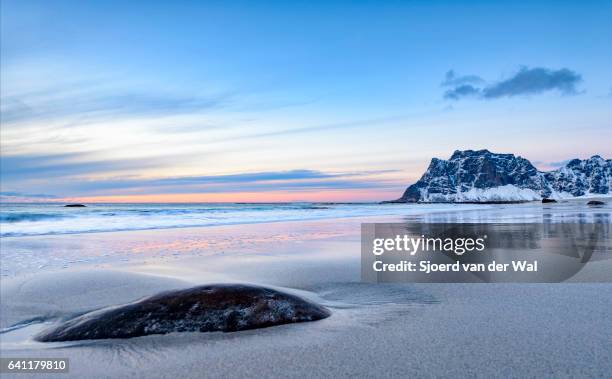 utakleiv beach in the lofoten archipel in norway at the end of a beautiful winter day - sjoerd van der wal stock pictures, royalty-free photos & images