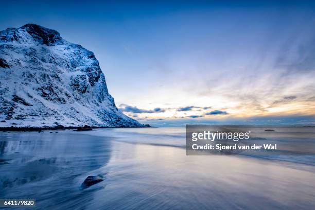 utakleiv beach in the lofoten archipel in norway at the end of a beautiful winter day - sjoerd van der wal stock pictures, royalty-free photos & images