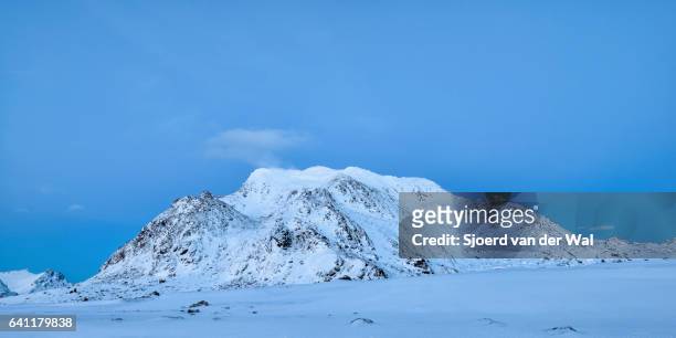 snow covered mountain after sunset in the lofoten - "sjoerd van der wal" stock pictures, royalty-free photos & images
