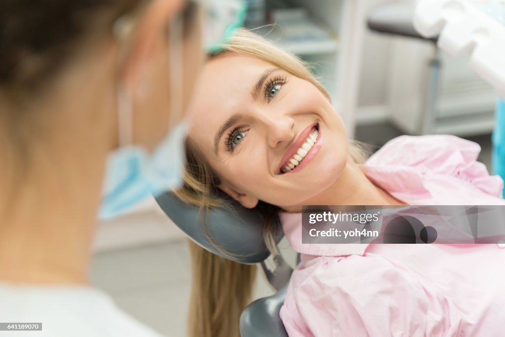 Beautiful patient smiling at doctor