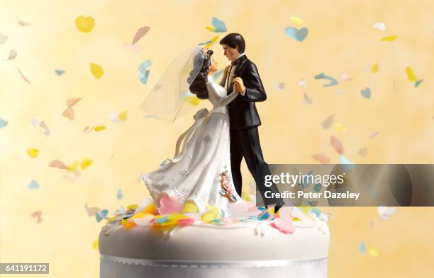 dancing wedding cake figurines - commitment stock pictures, royalty-free photos & images