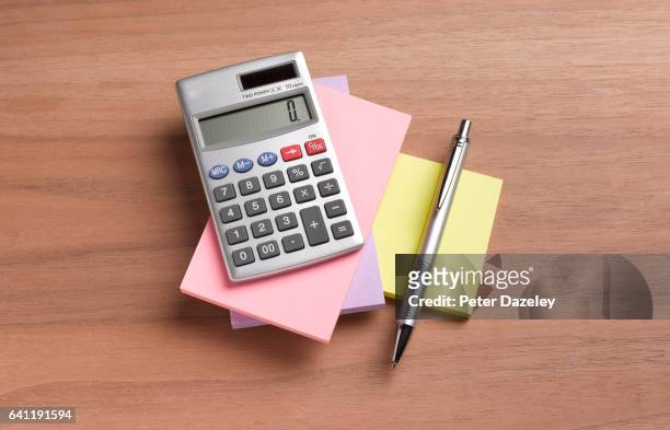 note pad, calculator and pen - calculator top view stock pictures, royalty-free photos & images