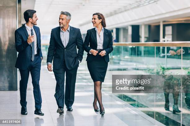 making business - business people in a row stock pictures, royalty-free photos & images