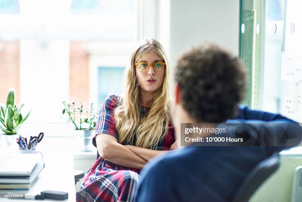 People talking in office.