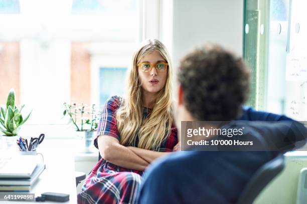 people talking in office. - talking stock pictures, royalty-free photos & images