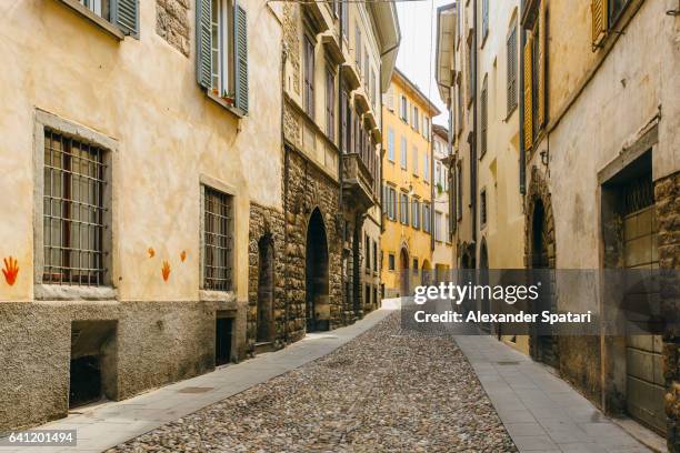 cobbled street in citta alta (old town) in bergamo, lombardy, italy - bergamo alta stock pictures, royalty-free photos & images