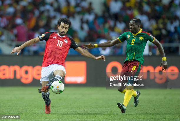 Of Egypt and OYONGO BITOLO AMBROISE of Cameroon during the CAN 2017 FINAL between Cameroon and Egypt at Stade de L'Amitie on February 05, 2017 in...