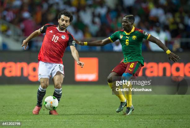 Of Egypt and OYONGO BITOLO AMBROISE of Cameroon during the CAN 2017 FINAL between Cameroon and Egypt at Stade de L'Amitie on February 05, 2017 in...
