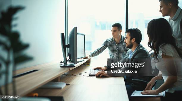 group of it experts in their office. - small group of people stock pictures, royalty-free photos & images