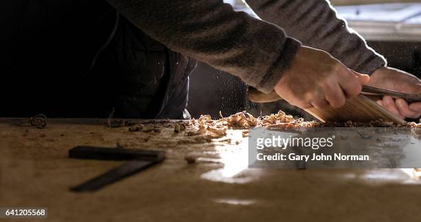 carpenter working in his workshop - artesanato imagens e fotografias de stock