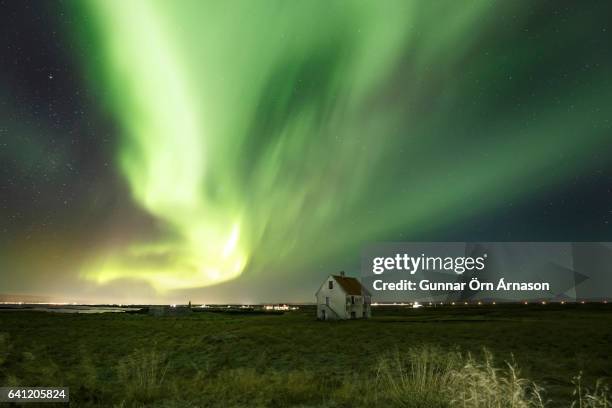northern lights aurora borealis - gunnar örn árnason stock-fotos und bilder