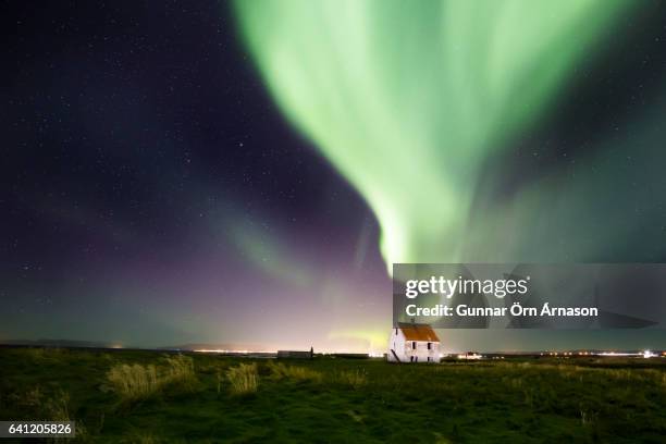 northern lights aurora borealis - gunnar örn árnason stock-fotos und bilder