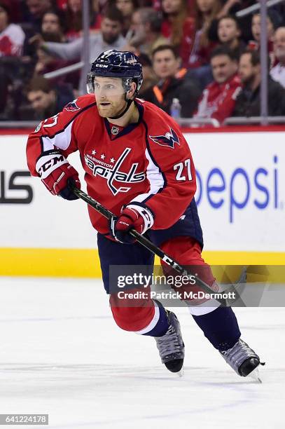 Karl Alzner of the Washington Capitals skates in the first period against the Carolina Hurricanes during an NHL game at Verizon Center on January 23,...