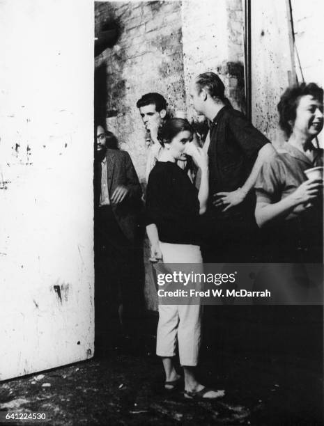 From left, American writer LeRoi Jones , Joe Rivers, married artists Patty and Claes Oldenberg, and American critic Rose Slivka attend a party, New...